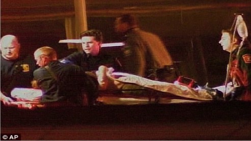 Paramedics_load_the_wounded_gunman